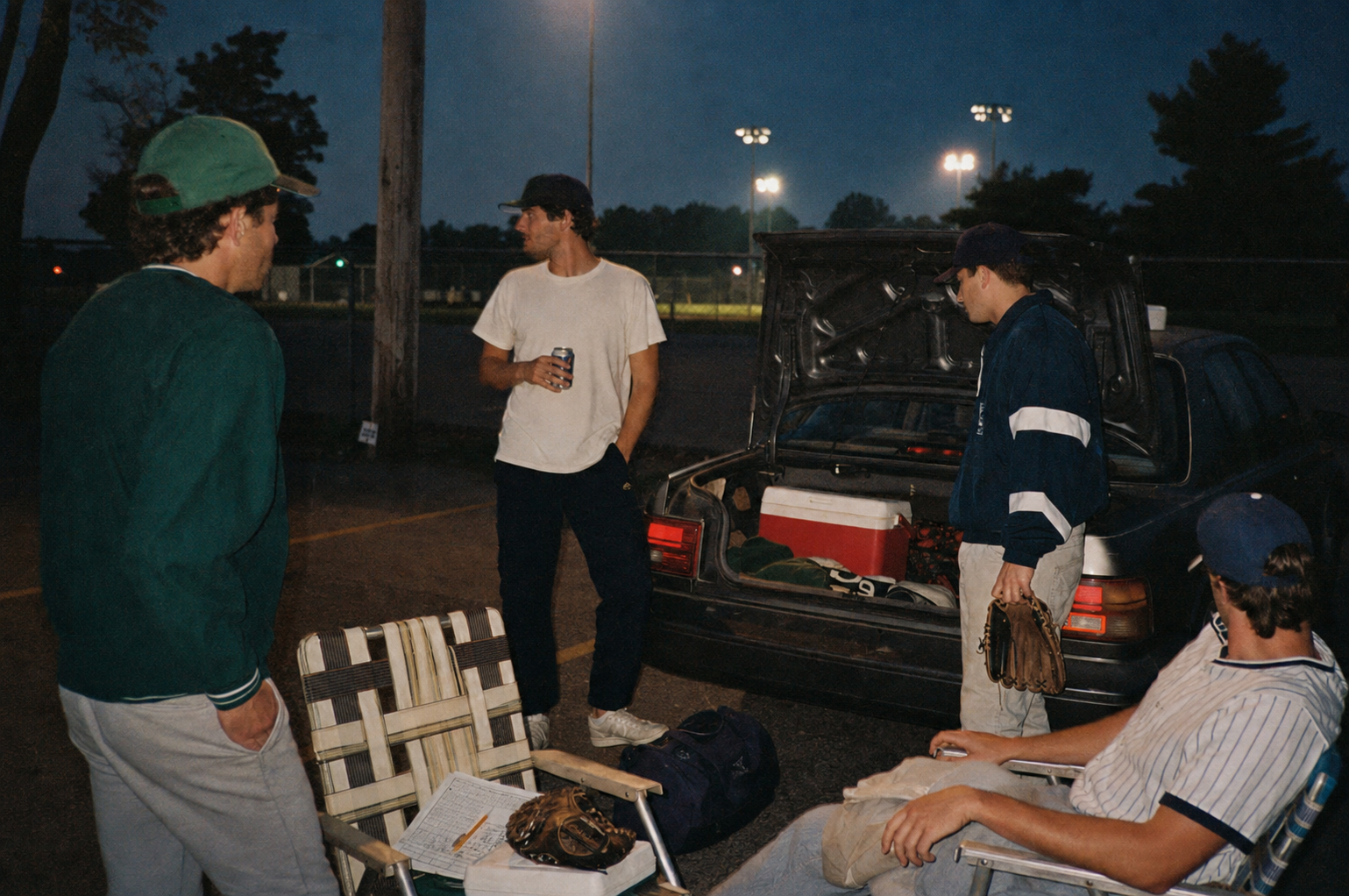 Post-game in the parking lot, lawn chairs and a trunk full of gear